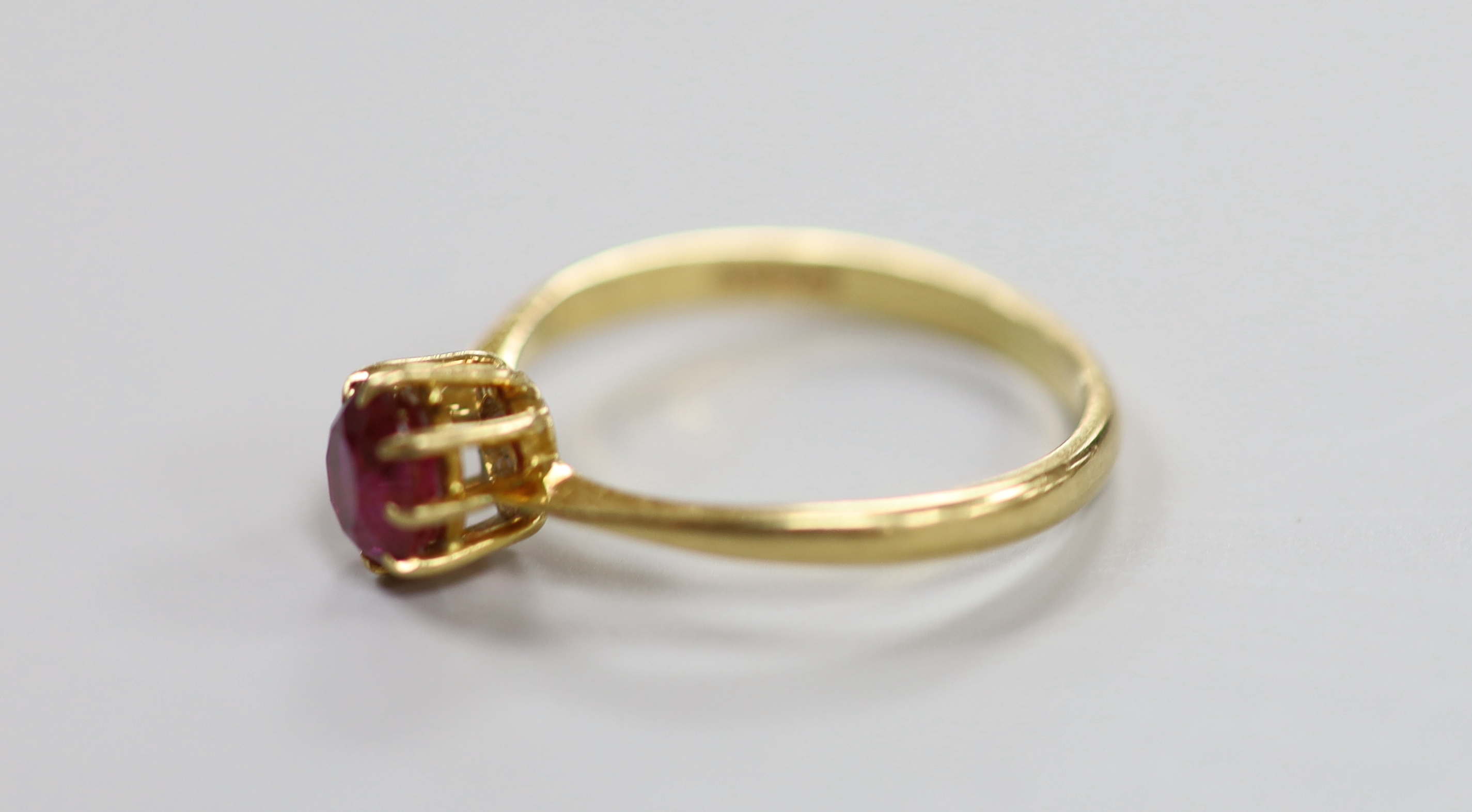 A 1960's 18ct gold and solitaire ruby set ring, size O, gross weight 2.2 grams.